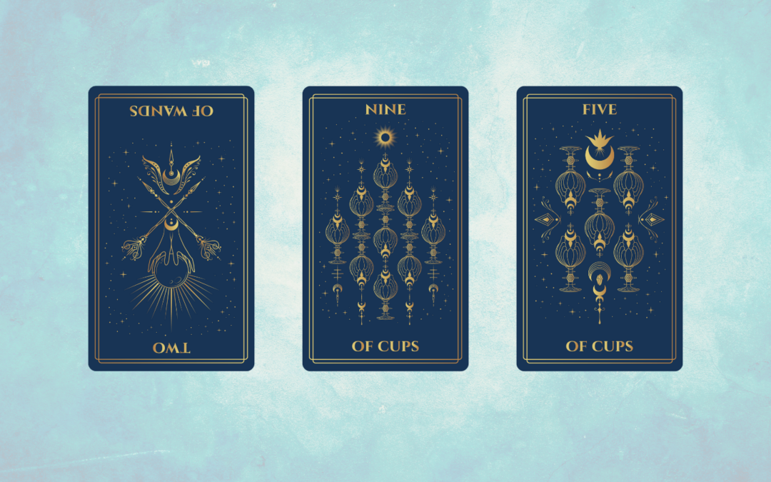 A digital tarot card spread featuring three cards against a light blue textured background. The cards have a deep blue color with gold illustrations and borders. The first card on the left is the Two of Wands reversed, depicting two crossed wands adorned with intricate celestial and floral elements, pointing downward, with a radiant sun and crescent moon beneath them. The center card is the Nine of Cups, showing nine ornate golden cups arranged symmetrically, surrounded by stars and a glowing sun at the top. The third card on the right is the Five of Cups, illustrating five golden cups in an inverted triangular pattern, with a crescent moon and crown-like symbol above them. The overall aesthetic of the image is celestial and mystical.